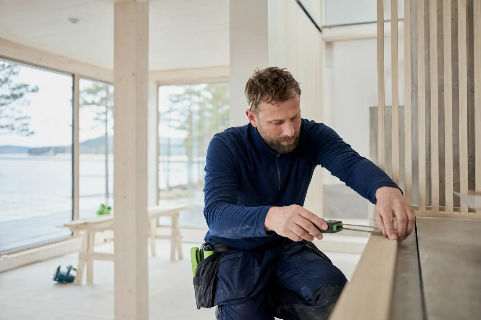 Carpenter working in a bright Norwegian home